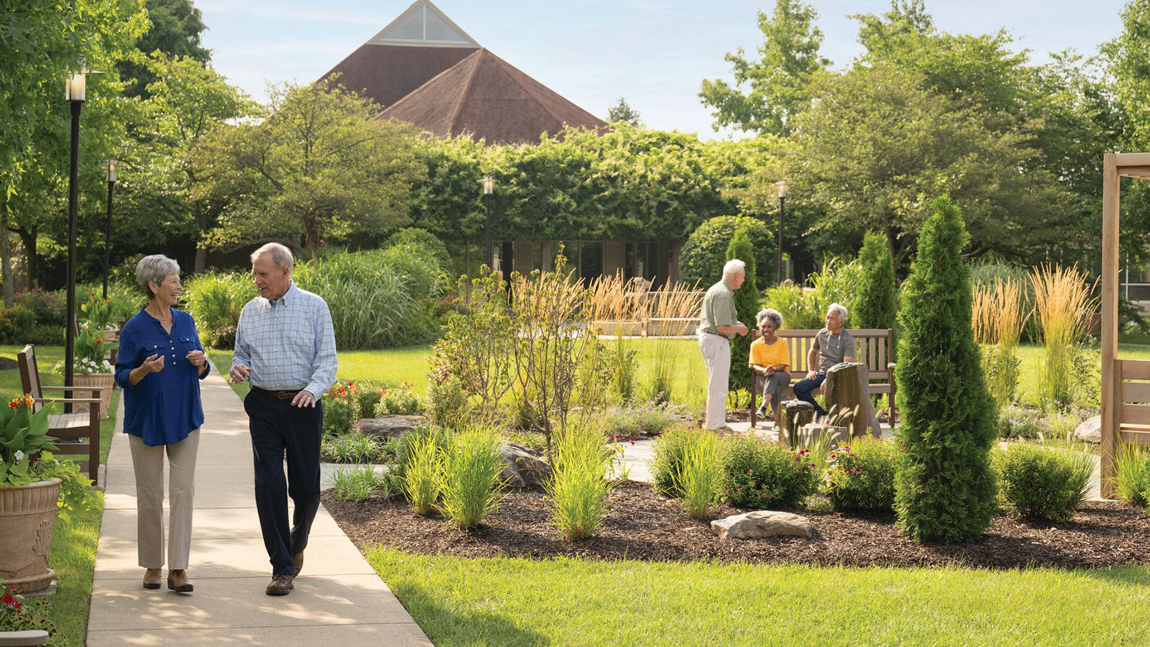 couple walking near garden