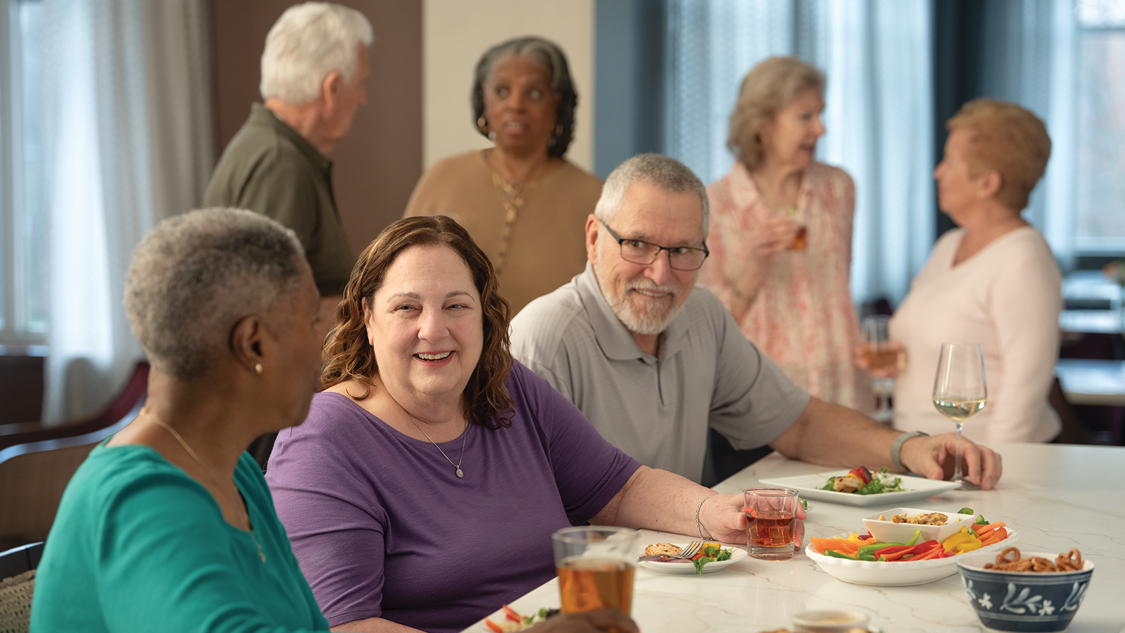 residents enjoying time together dining