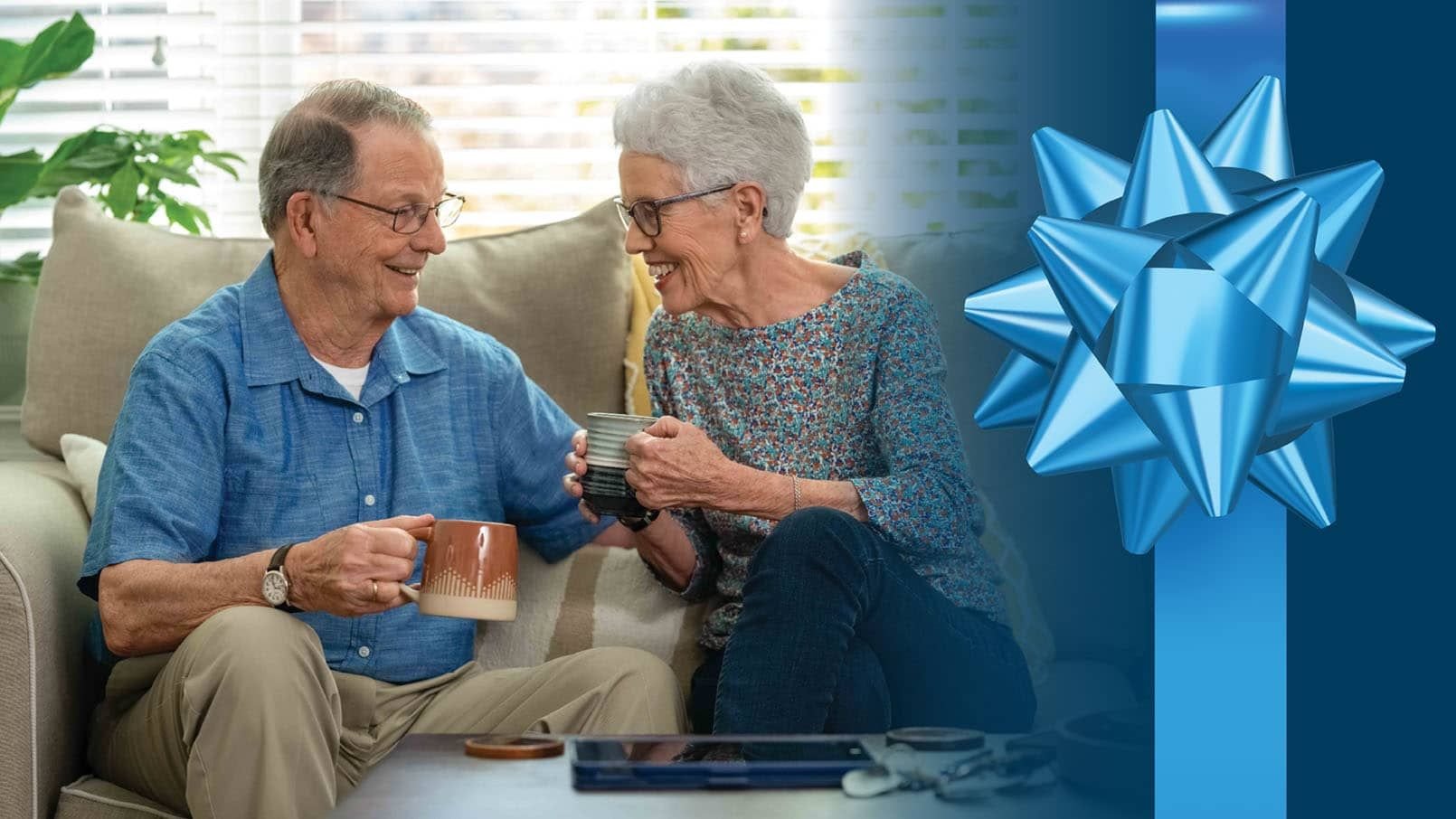 Two Residents talking with a gift bow wrapped around the photo